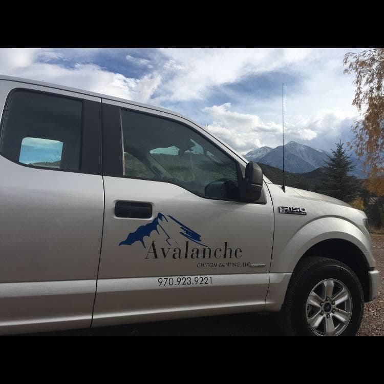 Avalanche Custom Painting truck with mountains in the background