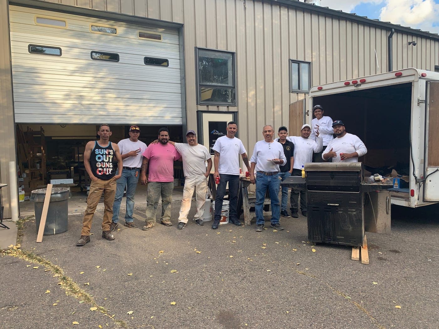 Avalanche Custom Painting crew outside a work truck