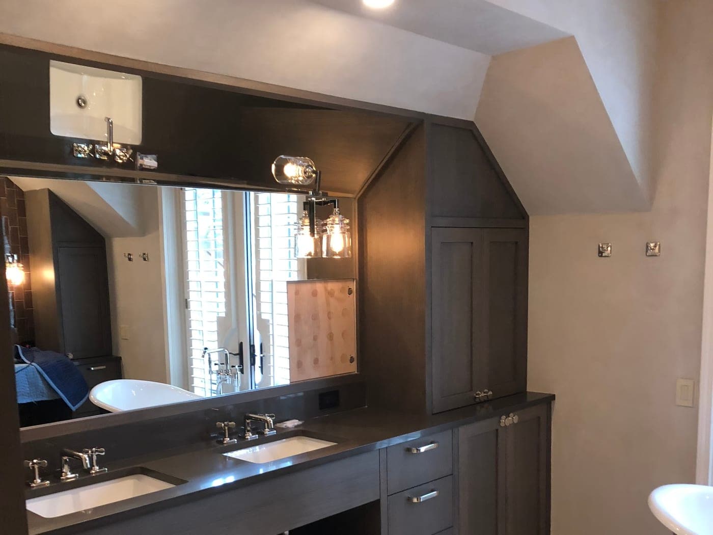 Dark finished vanity and cabinetry in an Aspen interior