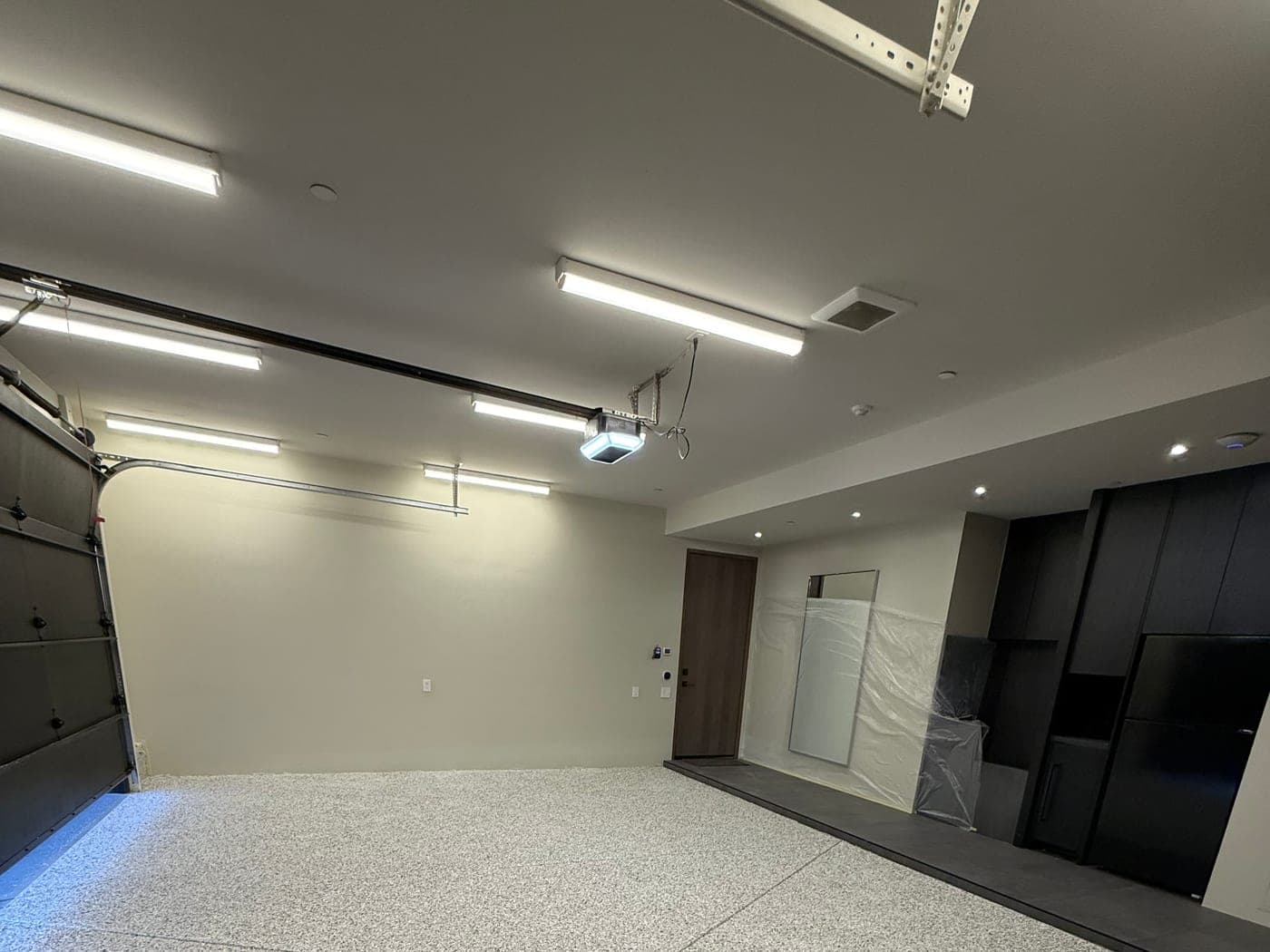 Large clean interior space prepared for painting and finish work